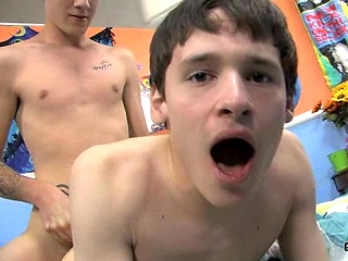 Rad Matthews shows candy factory worker, Damien Telrue, how he likes to pack fudge!